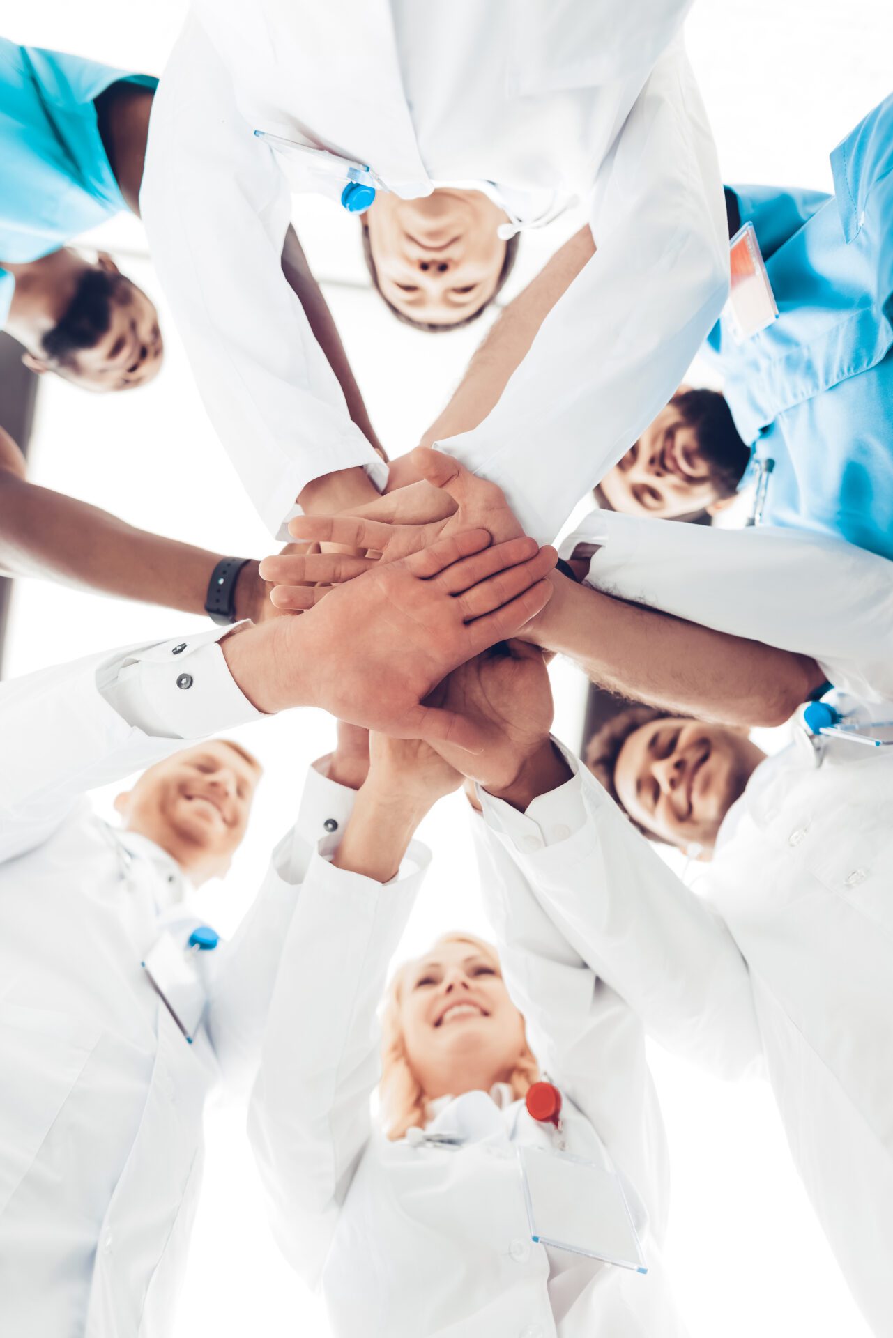 5815794 Professional Doctors Holding Each Other Hands.
